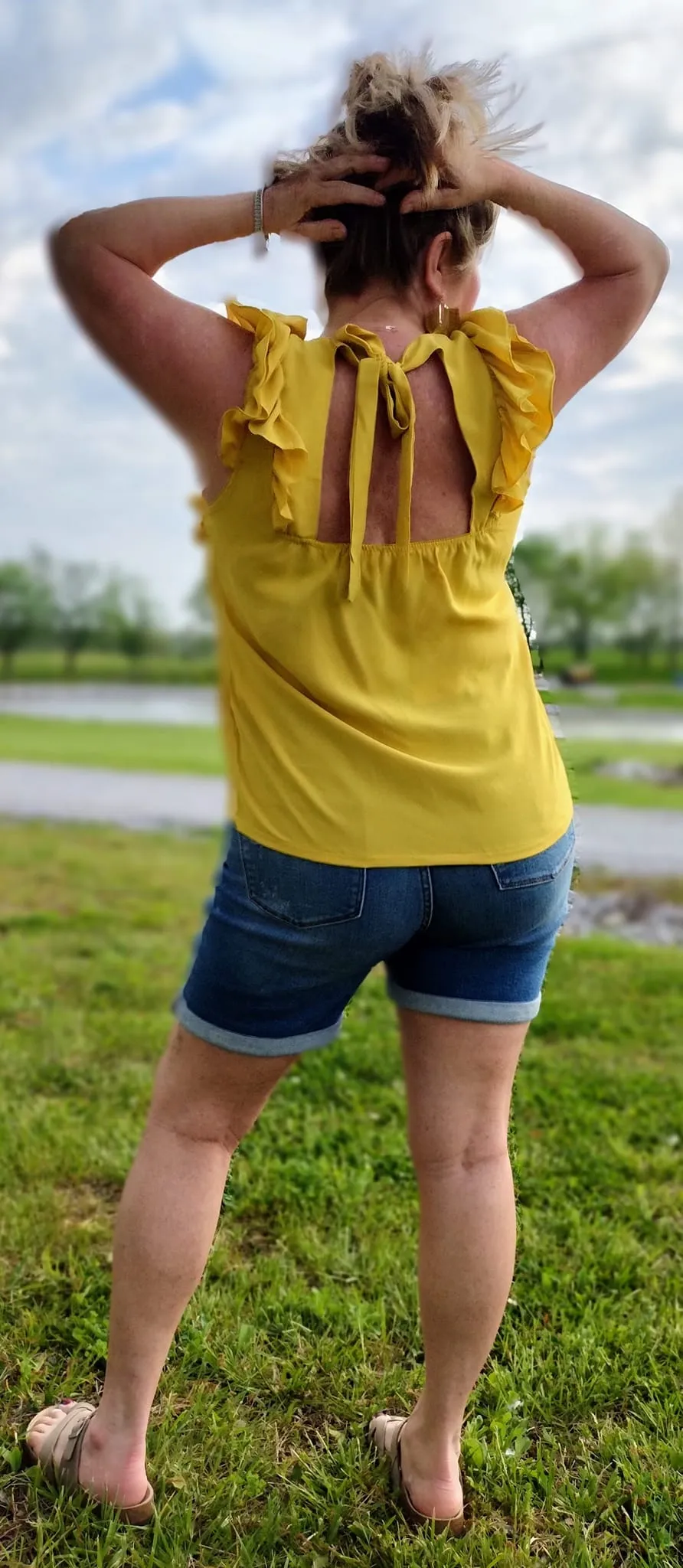 Ruffle Sleeveless Tied Back Blouse